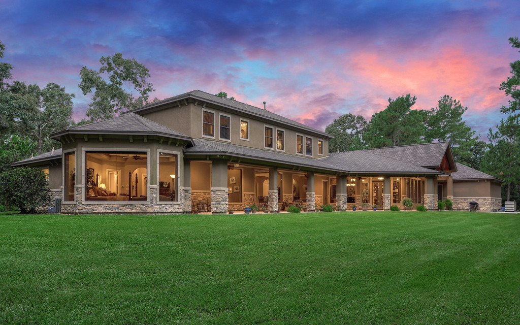 Custom home rear elevation with covered patio by Tyler Custom Homes