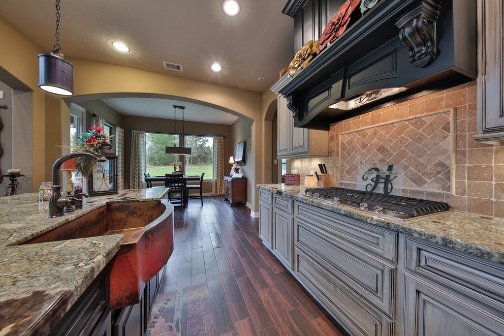 Custom kitchen with granite island by Tyler Custom Homes